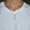 man wearing fish hook urn necklace